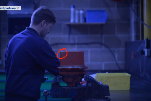Locate the grub screw on the side of the gearbox